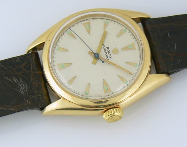 Rolex Oyster Perpetual
14k on strap 
"BIG BUBBLE BACK"