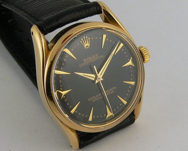 Rolex Bombay Oyster Perpetual YG/Strap