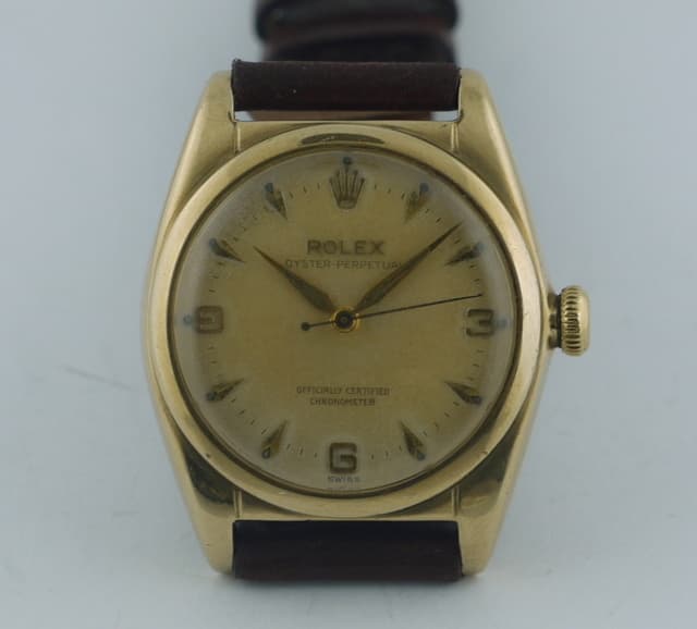 Rolex Oyster Perpetual
10k on strap 
"BUBBLE BACK"