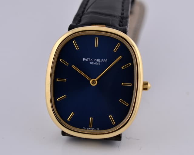 Patek Philippe Ellipse 18K YG Blue Dial W/ Deployant Buckle