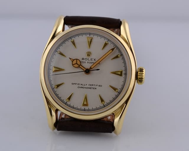 Rolex Bombay Bubble Back Cream Dial 14K Yellow Gold Circa 1950 33MM