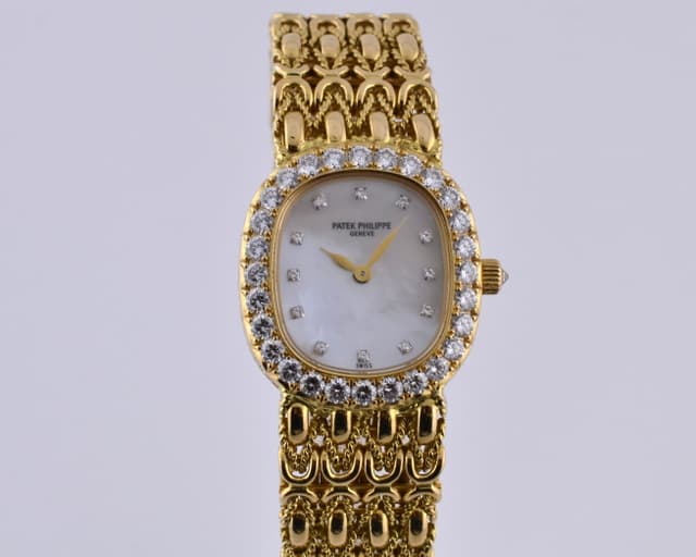 Patek Philippe Ellipse Diamond Bezel
18K Yellow Gold MOP Dial