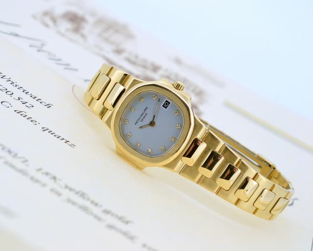 Patek Philippe Nautilus Ladies Light Blue Diamond Dial 18K Yellow Gold 