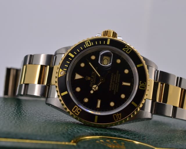 Rolex Submariner Black Dial 18K Yellow Gold / SS