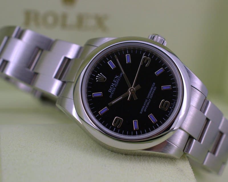 Rolex Oyster Perpetual Ladies Black Dial / Blue Numbers