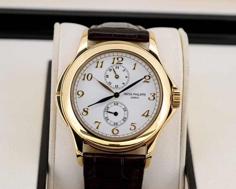Patek Philippe Travel Time 18K Yellow Gold Manual Wind