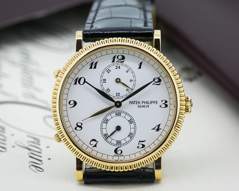 Patek Philippe Travel Time 18K Yellow Gold
