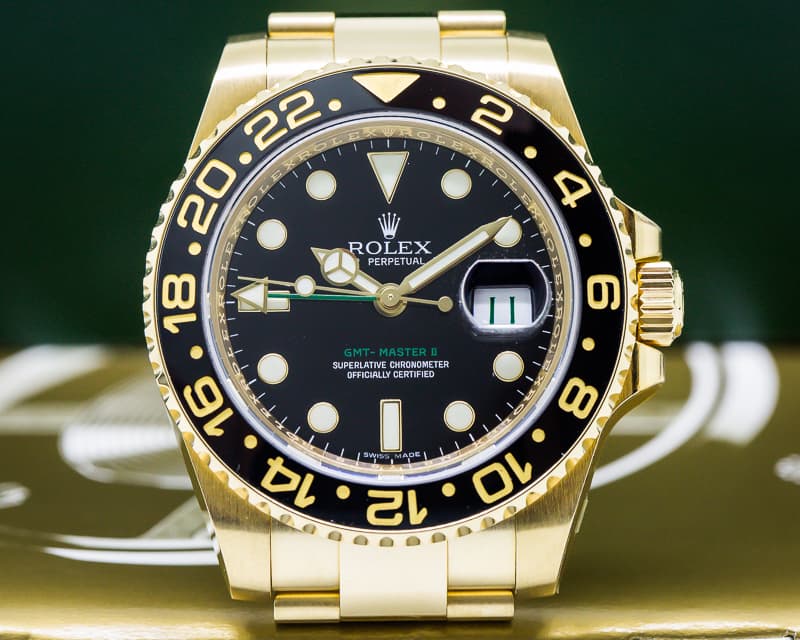 Rolex GMT Master II Black Dial 18K Yellow Gold / Bracelet