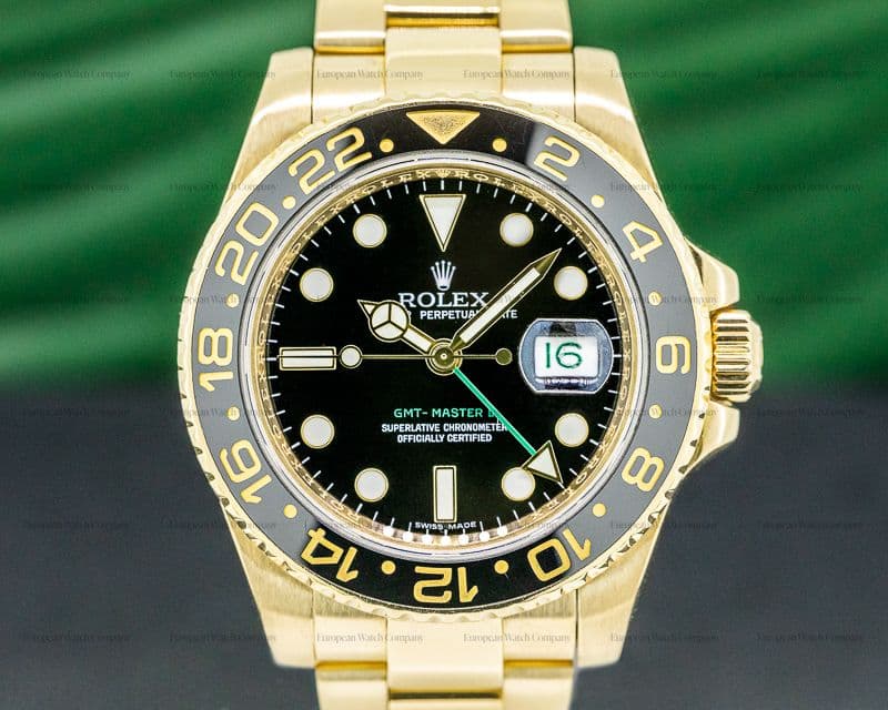 Rolex GMT Master II 116718 Black Dial 18K Yellow Gold / Bracelet