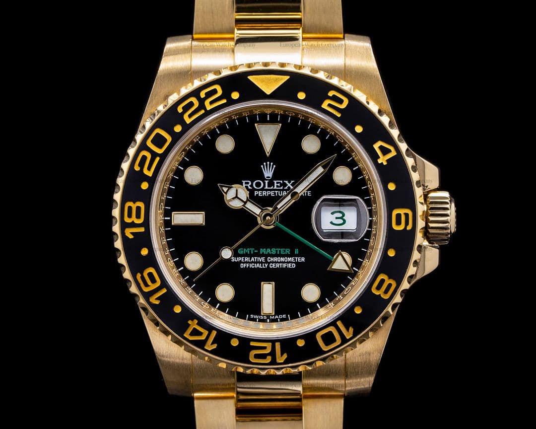 Rolex GMT Master II Black Dial 18K Yellow Gold / Bracelet