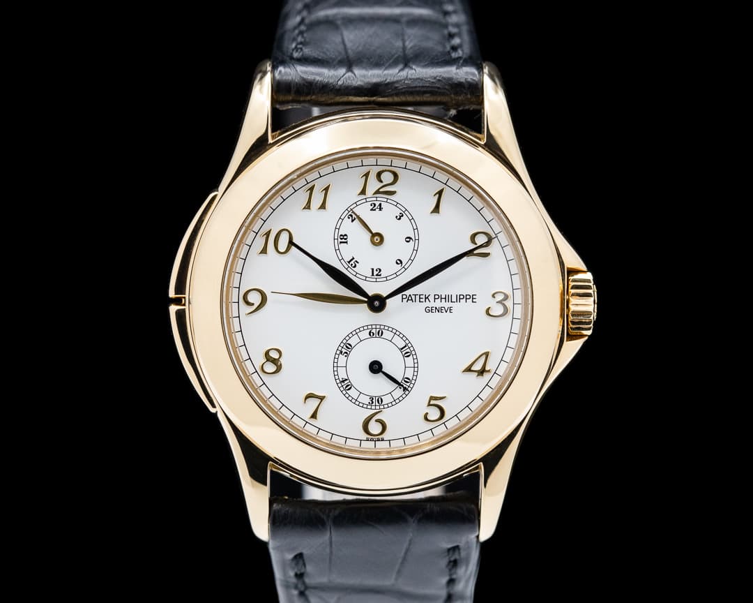 Patek Philippe Travel Time 18K Yellow Gold Manual Wind