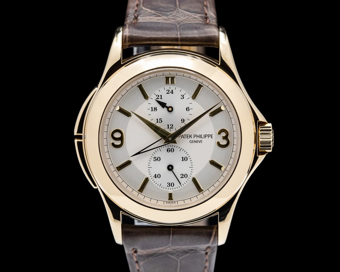 Patek Philippe Travel Time 18K Yellow Gold Manual Wind Deployant