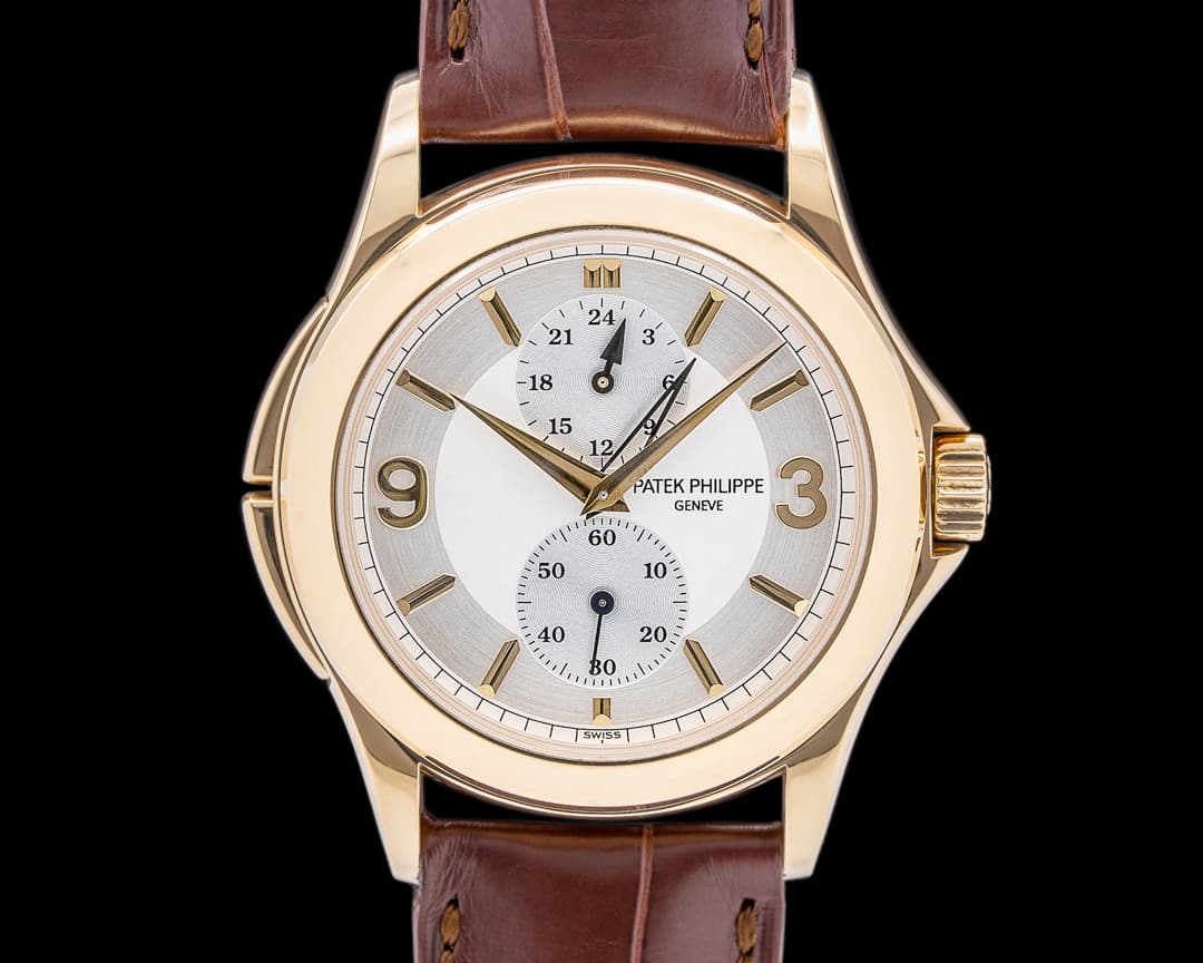 Patek Philippe Travel Time 18K Yellow Gold Manual Wind Deployant