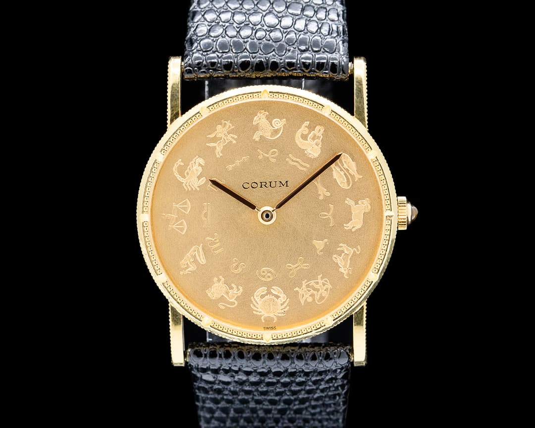 Corum 57245.56 Astrological Zodiac 18K Yellow Gold Champagne Dial