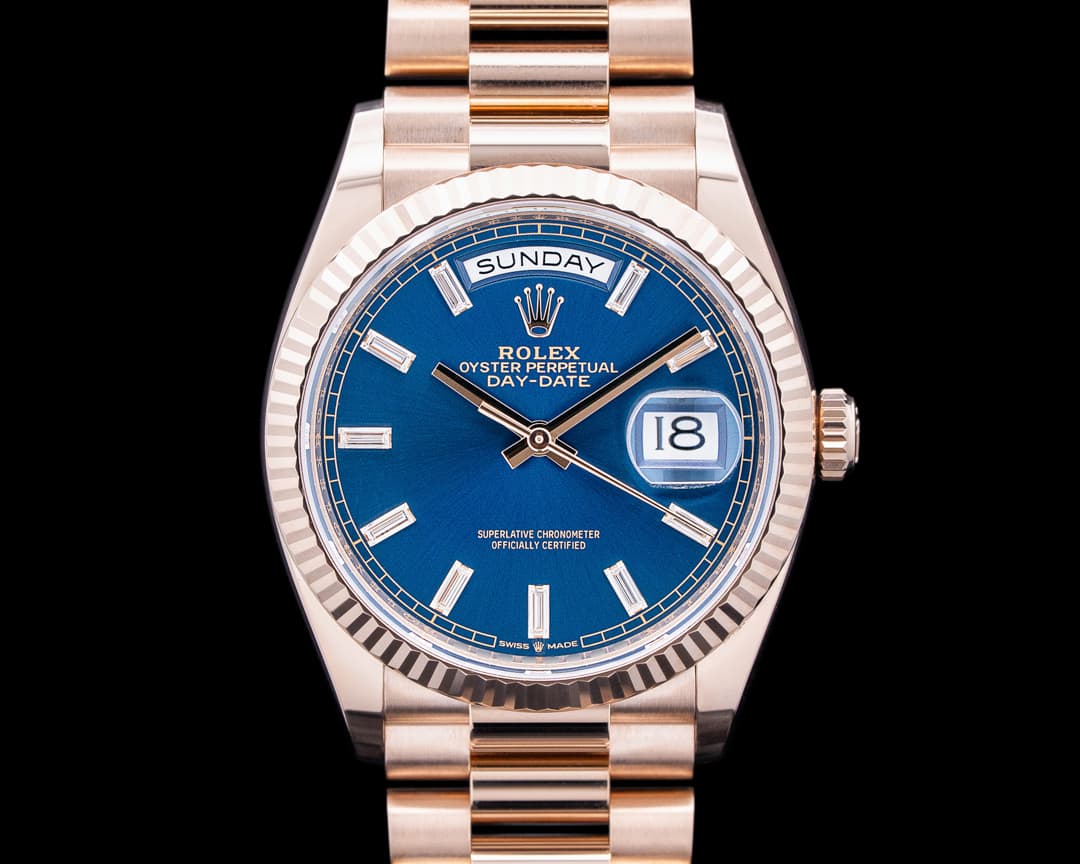 Rolex 128235 Day Date President 18K Rose Gold Blue Baguette Dial