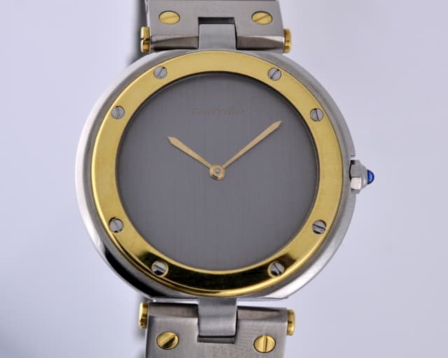 Cartier Santos Round Quartz
18K Yellow Gold and Stainless Steel