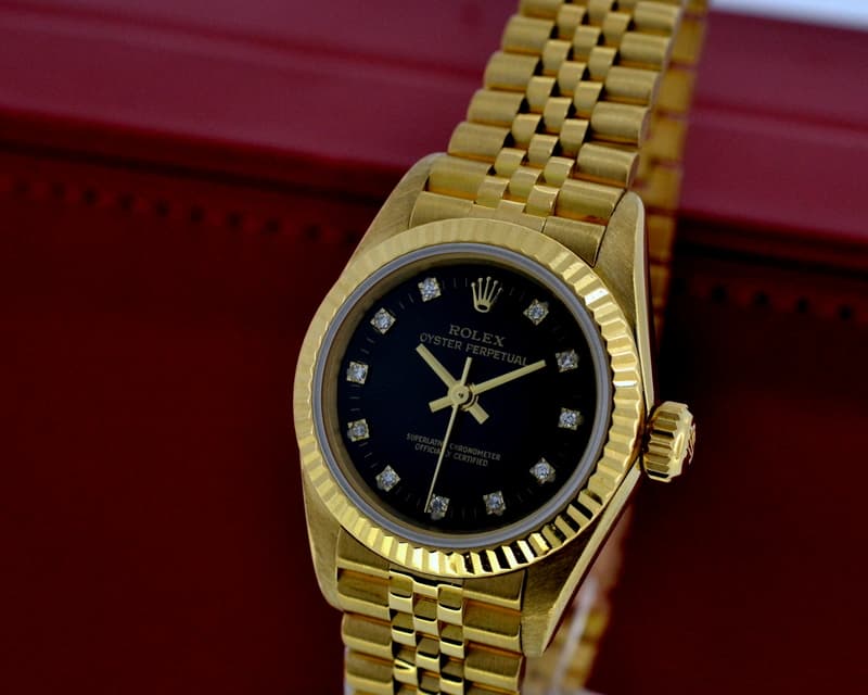 Rolex Oyster Perpetual Ladies 18K Yellow Gold Black Diamond Dial