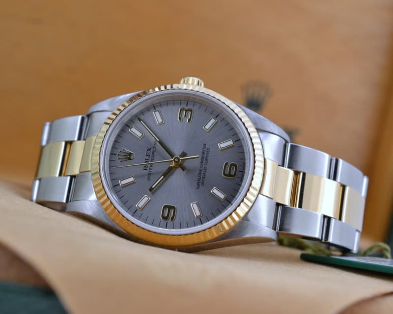 Rolex Oyster Perpetual Silver Dial Arabic Numerals 18K Yellow Gold / SS